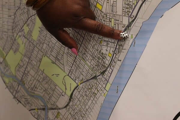 Woman shot tracing her walking route on a map